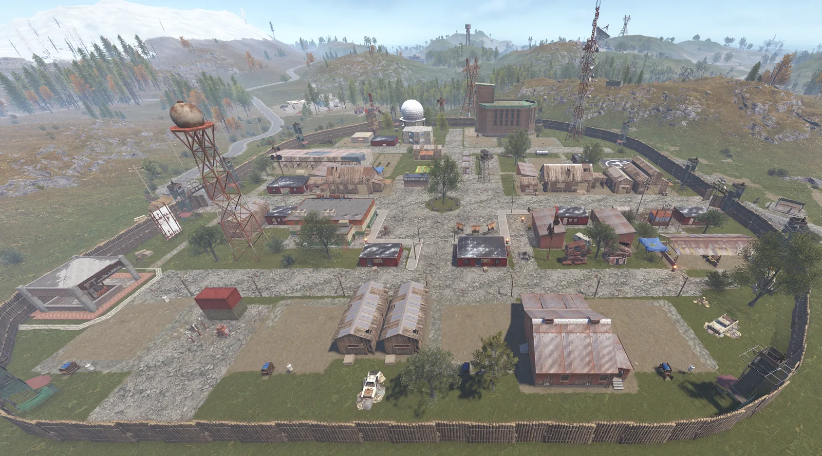 The Town from above: a walled trade hub with shops, towers, a water tower and the dome